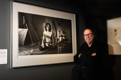 Aubrey Powell in the Browse Gallery exhibition Daring to Dream. 50 Years of Hipgnosis, in front of a cult photo by Aubrey Powell/ Hipgnosis of Syd Barrett in Yoga position. Photo: John G. Moore.